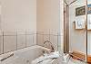 .Full bathroom with tub and separate shower. 