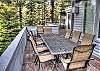 Upper level deck with patio table and chairs