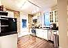 Bright kitchen with exposed brick walls