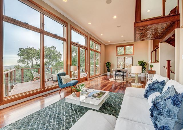 Kick back in the living room with ample seating and enjoy the wraparound views.