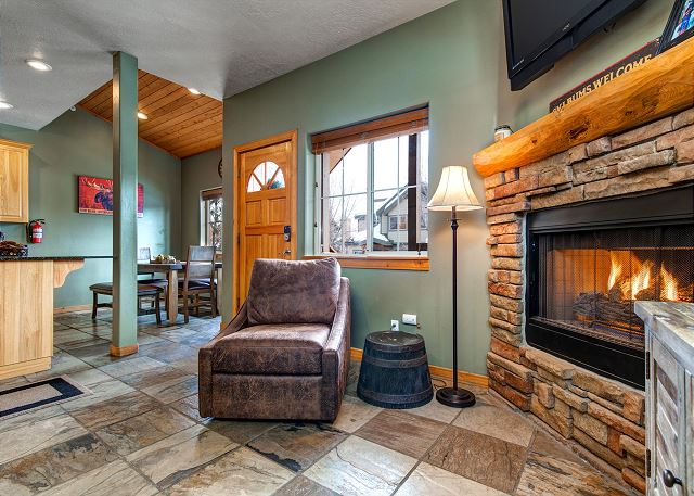Main Level Living Area with Comfortable Seating, Gas Fireplace and TV