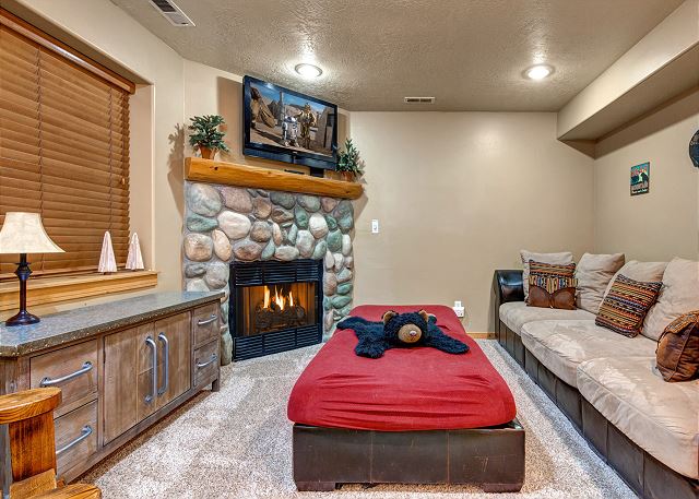 Lower Level Den with Comfortable Seating, Gas Fire Place and TV