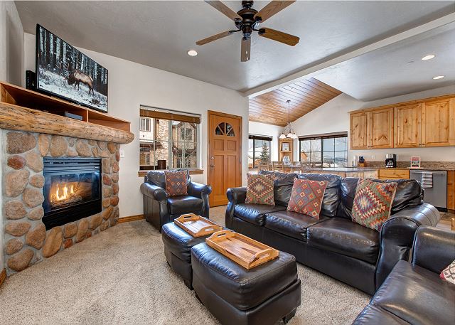 Main Level Living Room with Large HD Smart TV and Gas Fireplace