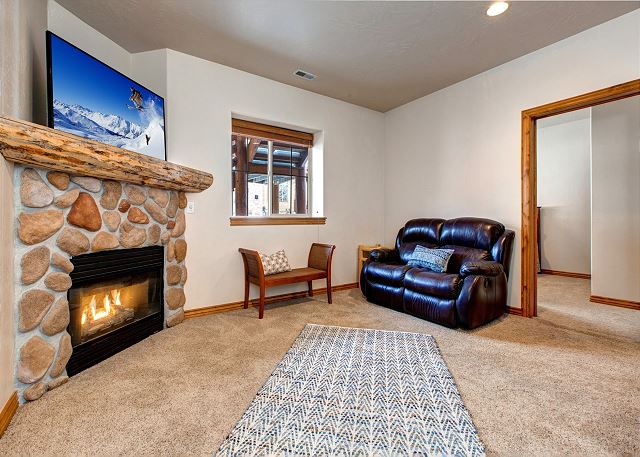 Lower Level Livingroom/Den with Large HD Smart TV and Gas Fireplace. Large Floor Space for Queen Air Mattress