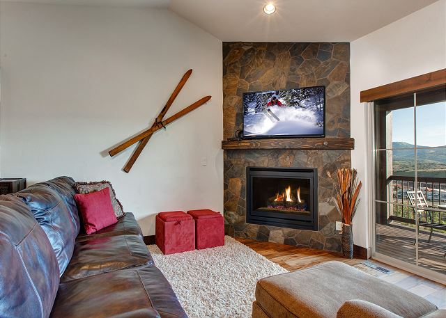 Living Room with 50" HD TV, ceiling fan, gas fireplace PLUS walk-out balcony with seating, BBQ and amazing views!