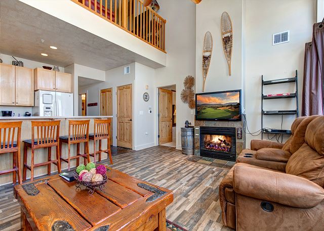 Main Living Area with Large, Tall Windows for Beautiful Mountain Views and Light - Gas Fire Place and TV
