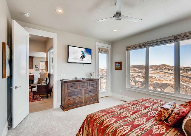 Main Level Master Bedroom with King Bed, En Suite Bathroom with Separate Soaking Tub and Shower PLUS a Large TV and Walk-out to Balcony with Seating and Views!