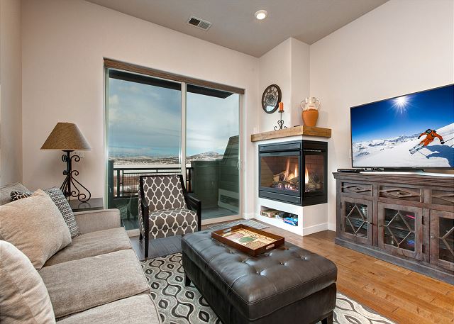 Living Room with Sleeper Sofa, 2-sided Gas Fireplace and Balcony with Views!