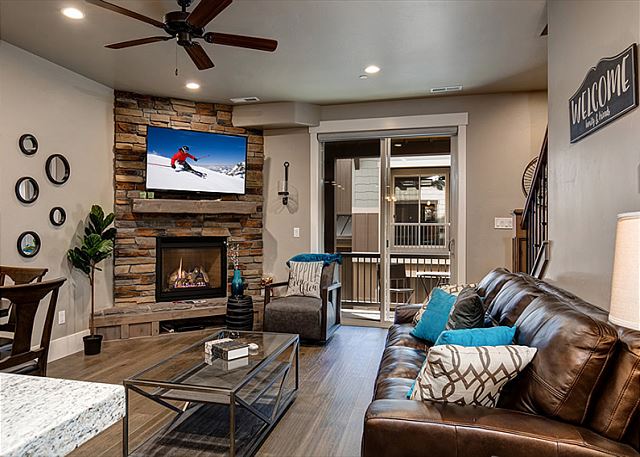 Main Living Room with Gas Fireplace, Large Smart TV and Queen Sleeper Sofa