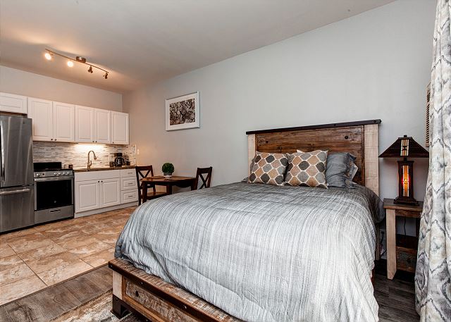 Spacious Studio with Queen Bed, Two Twin Sleeper Chairs, TV, Full Kitchen/Dining and Patio