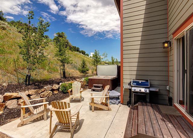 Private rear patio with BBQ, Fire Pit, Adirondack Chairs and Large Hot Tub!