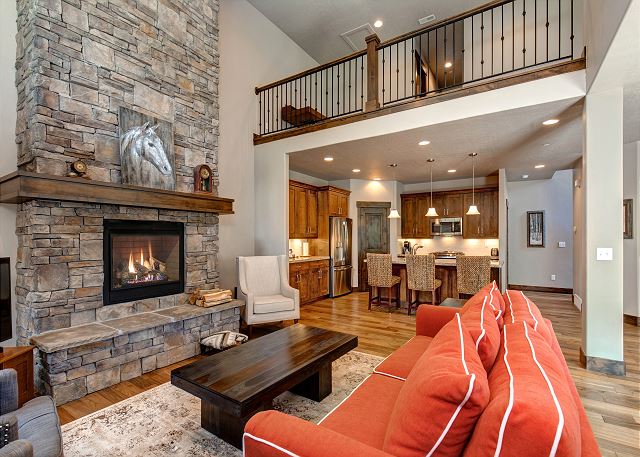 The beautifully-decorated, open main level features a gorgeous living room with plenty of seating, a 60” HD TV with Apple TV hooked up, a cozy gas fireplace.