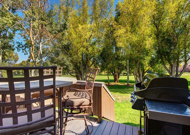 Deck on golf course with seating and BBQ