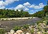 The Rocky River Branch of the Saco River is just a short walk from this beautiful Woodland Pines unit