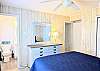 Bright sun-filled bedroom of D4 Briar Court with an entry to the primary bedroom suite.