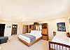 master bedroom with a king bed and a twin 