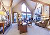 Vaulted ceiling, natural light, and large windows.