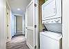 Stack-on washer and dryer located in the hall closet.