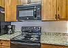 Electric stove and above range microwave.