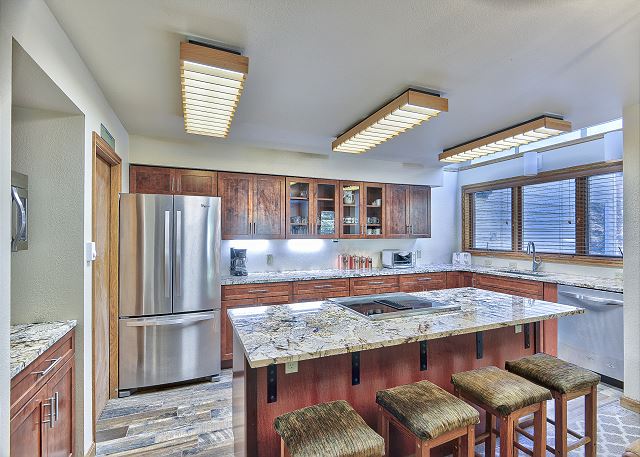 Beautifully upgraded space with granite counters, hardwood flooring, and stainless steel appliances.