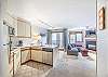 Open Floor Plan-
Living area, kitchen, and dining area all flow together in the open floor plan of this studio unit.