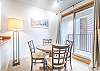 Dining Area-
Round table with seating for four and access to the private balcony.