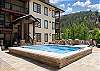 Fraser Crossing amenity deck with OVERSIZED hot tub, fire place and BBQ's for all guests to enjoy