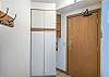 Offers closet space as well as coat rack.