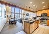 Living area, dining area, and kitchen all flow together nicely with the open floor plan. 