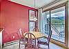 Dining Area-
Table with seating for 4 next to sliding doors to private balcony.