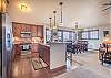 Living area, dining area, and kitchen all flow together nicely with the open floor plan.