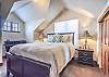 Third Bedroom-
Located on the top floor with queen bed, desk, flat screen TV, and en-suite bathroom.