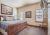 Fourth Bedroom-
Located on the main level of the home with a king bed and flat screen TV.