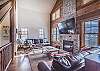 Living Area-
Spacious area with high ceiling, fireplace, and flat screen TV.