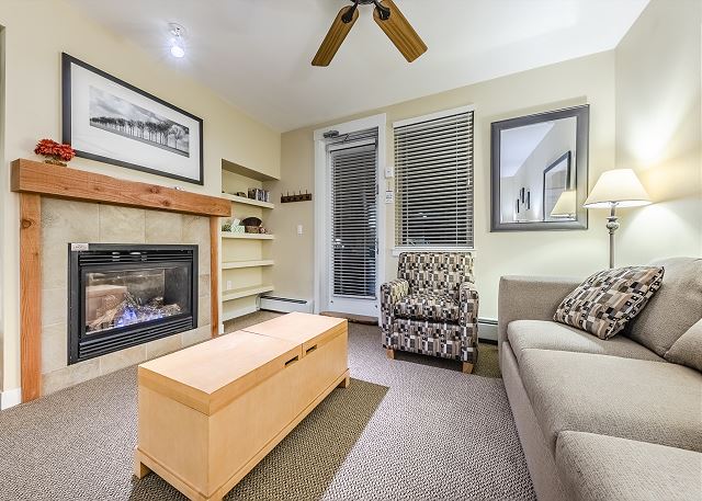 Queen size sofa sleeper, gas fireplace, flat screen TV, and access to private balcony.