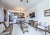 Living area, dining area, and kitchen all flow together nicely within the open floor plan. 