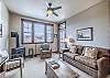 Queen size sofa sleeper, access to the private balcony, and a gas fireplace.