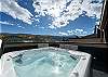 Rooftop deck with amazing views private hot tub, lounge style seating, and patio dining set