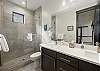 En-suite primary bathroom with large walk in shower (located off the primary bedroom)