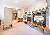 Great Room-
Queen size sofa sleeper, fireplace, and flat screen TV.