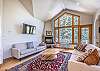 Living Area-
Wall mounted flat screen TV, corner fireplace unit and 2 cozy sofas.