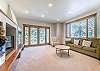 Great Room-
Located on the lower level of the home with a large flat screen TV, large windows that provide natural lighting, and a fireplace. 