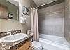 Bathroom-
Located upstairs next to the primary bedroom with a full size tub/shower combo. 