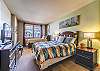 Second Bedroom-
Flat screen TV, large window, and sleeping space for up to 4 guests.