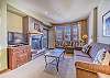 Living Area-
Flat screen TV, fireplace, and access to the private balcony. 
