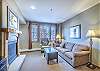 Living Area-
Queen sofa, gas fireplace, and access to the private balcony. 