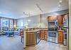 Kitchen-
Granite counters, full size stainless steel appliances, and a variety of cooking utensils. 