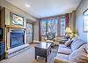 Living Area-
Gas fireplace, flat screen TV, and queen sofa sleeper.