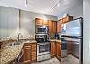 Kitchen-
Full size stainless steel appliances, double sinks, and a variety of cooking utensils. 
