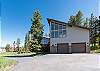 Two car garage with plenty of space for outdoor parking.